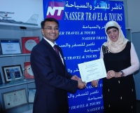 Ms.Raihana Presenting "Certificate of Appreciation" to Mr.Nilesh-Sabre Travel Network