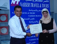 Ms.Raihana,Travel Manager,Nasser Travel and Tours,Presenting Certificate of Appreciation to Mr.Ambrose,Business Development Manager,Explore Bahrain